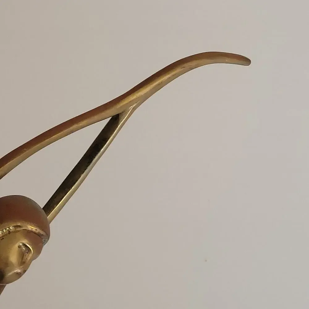 Vintage Mid-Century Modern (MCM) brass sculpture of an elongated female figure